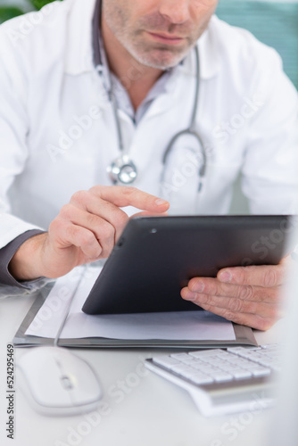young doctor using digital tablet