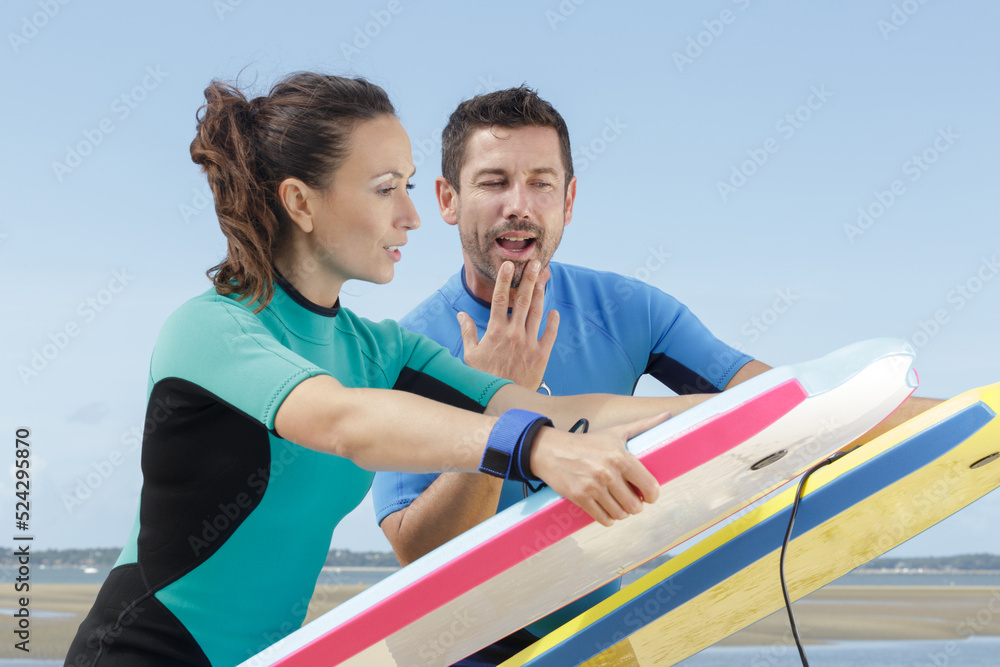 Fototapeta premium a beginner surfer with bodyboard