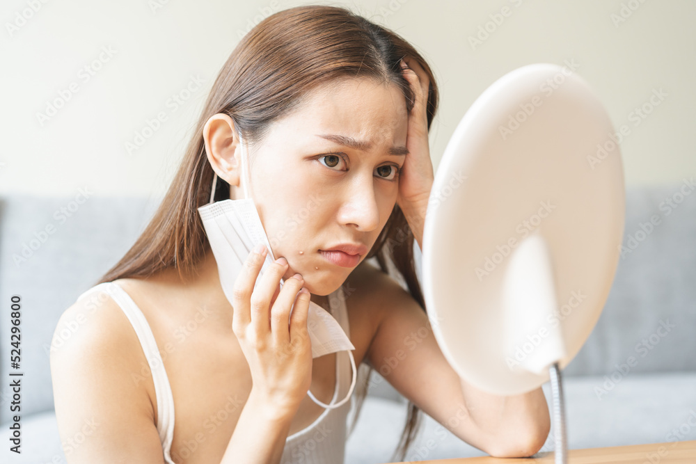 Expression worry asian young woman hand touching pustule around the chin and mouth, allergic when wear mask, makeup, show squeezing pimple spot from face. Beauty care, skin problem by acne treatment. Expression worry asian young woman hand touching pustule around the chin and mouth, allergic when wear mask, makeup, show squeezing pimple spot from face. Beauty care, skin problem by acne treatment.