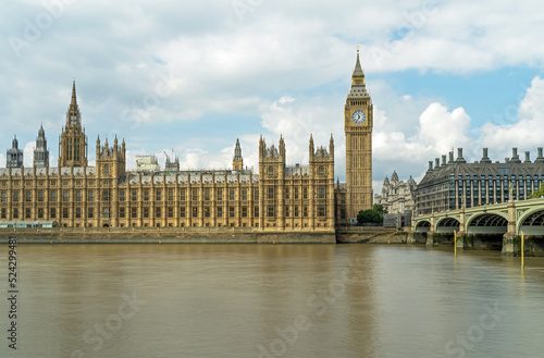 Houses of Parliament and Westminster Bridge in London on a cloudy day 