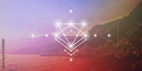Sacred geometry spiritual new age futuristic illustration with interlocking circles, triangles and glowing particles in front of blurry natural photographic background