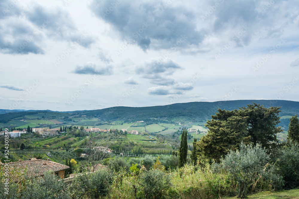 Landscape of the field and mountain near the medieval town of San Gemignano, Tuscany, Italy.