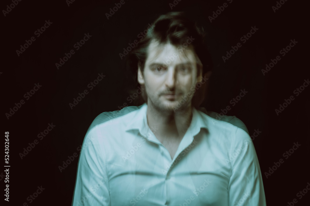 Fototapeta premium abstract blurry portrait of a man with mental and depressive illness with bipolar disorder