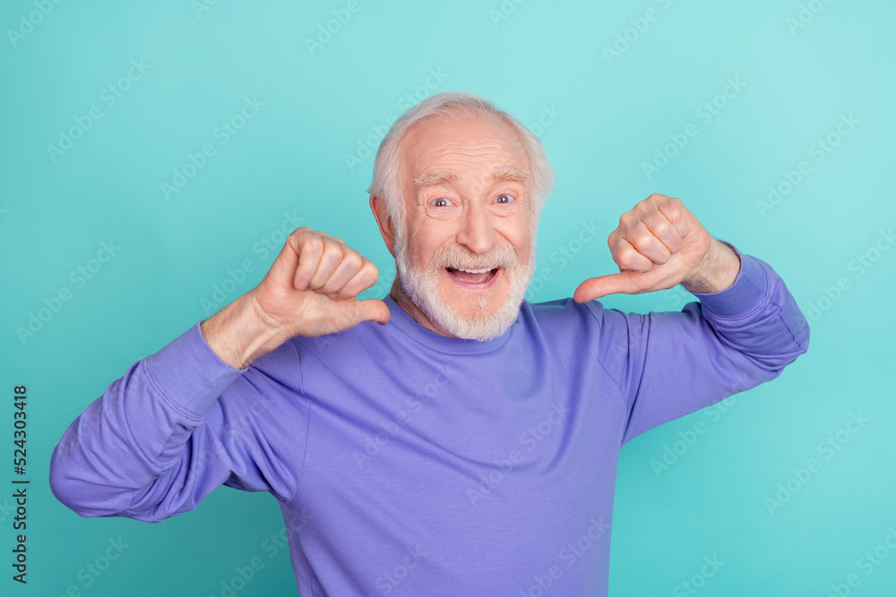Photo of excited cheerful man indicate thumb fingers himself isolated on turquoise color background Photo of excited cheerful man indicate thumb fingers himself isolated on turquoise color background