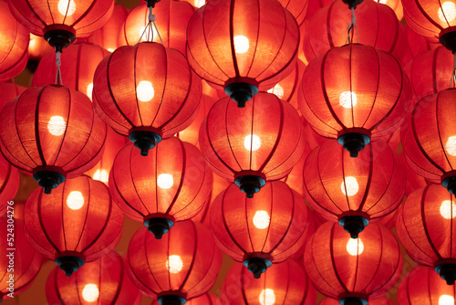 a lot of chinese red lamps hang on the ceiling - Colorful paper lanterns.