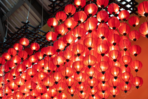 a lot of chinese red lamps hang on the ceiling - Colorful paper lanterns.