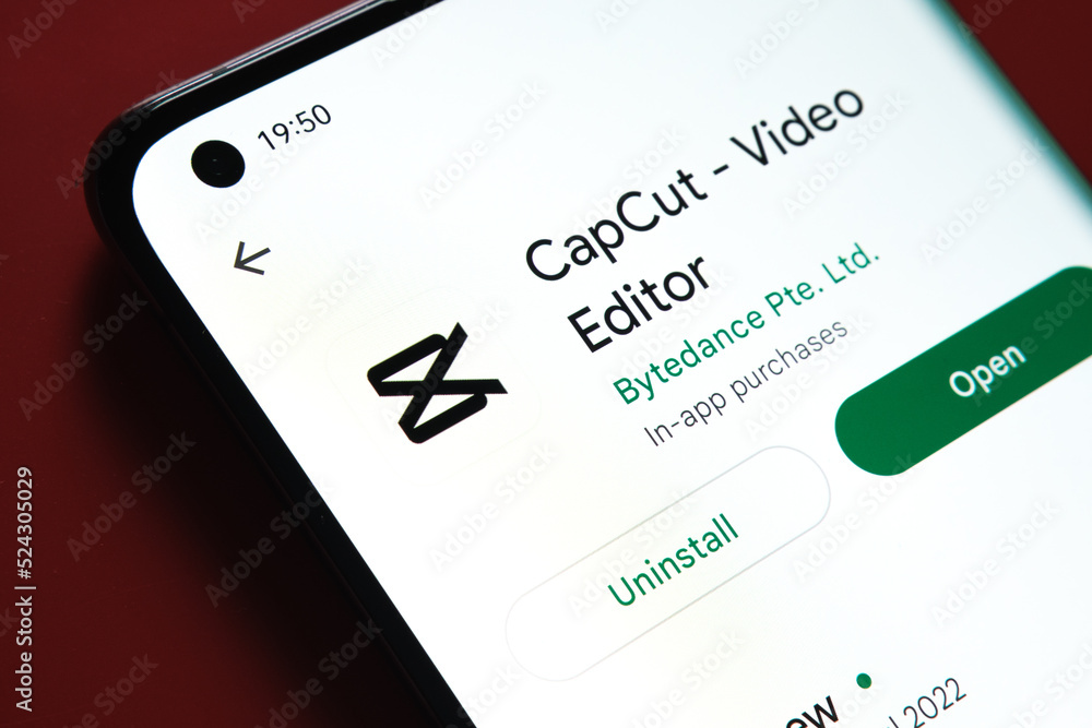 CapCut App Play Store Page on Smartphone on Ceramic Stone