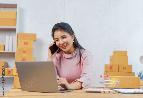 Portrait young Asian small business owner home office checking email online orders of product for deliver to customer. © makibestphoto