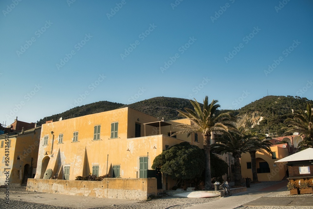 the Etruscan village of Varigotti with its characteristic yellow colored houses photographed along the Mediterranean coast