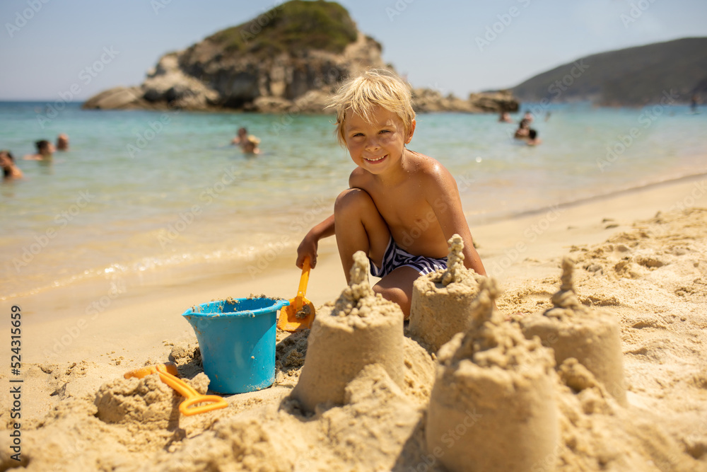 Happy child on the beach, enjoying summer, playing Happy child on the beach, enjoying summer, playing