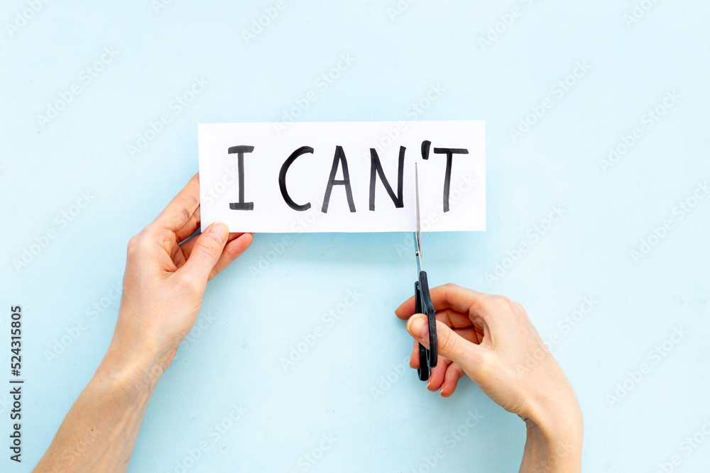 Hands changing words I cannot to I can with scissors. Selfmade concept Hands changing words I cannot to I can with scissors. Selfmade concept