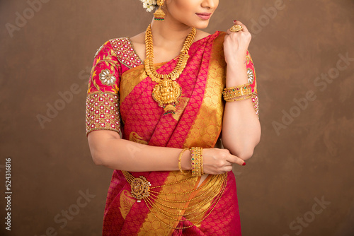 Beautiful Indian young Hindu Bride jewelry on studio shot.