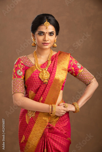 Beautiful Indian young Hindu Bride jewelry on studio shot.