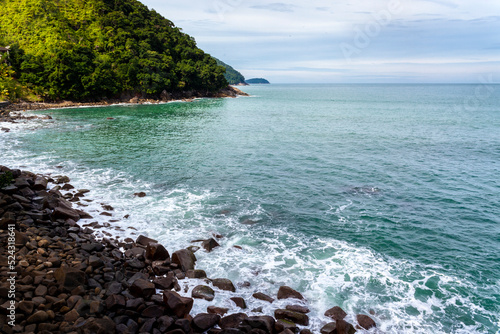 фотографія ocean waves beat against the rocks