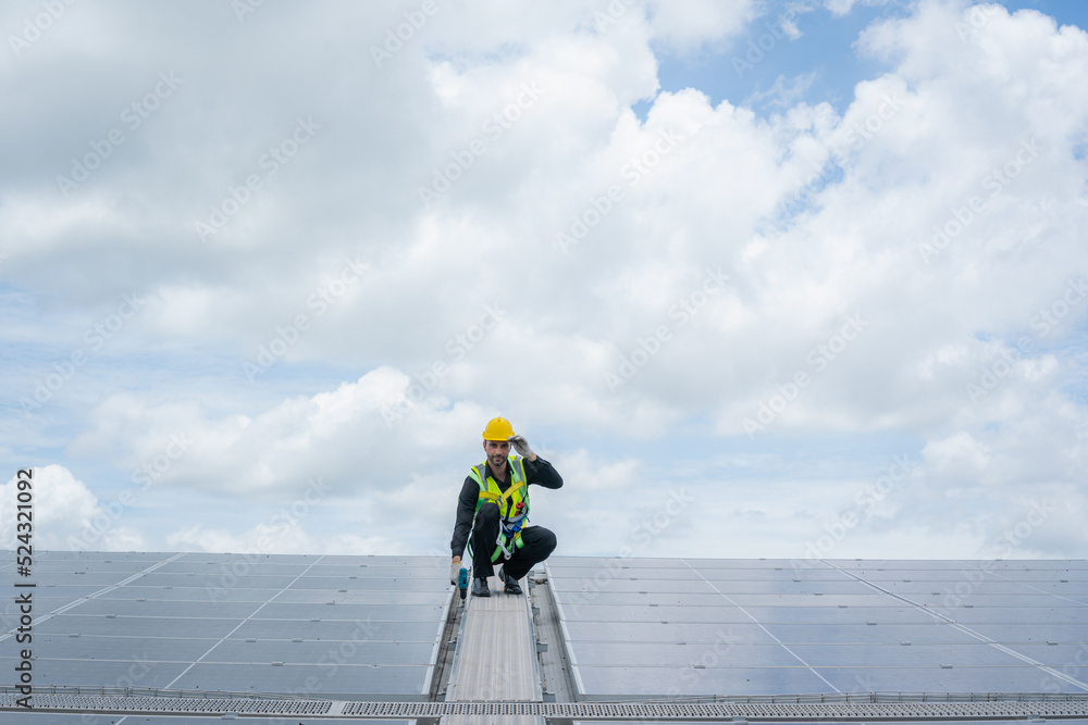 Technician checking Solar panel on top roof,Sun energy,Solar panel, Alternative electricity source,Concept of sustainable resources. Technician checking Solar panel on top roof,Sun energy,Solar panel, Alternative electricity source,Concept of sustainable resources.