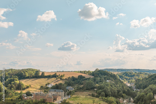 Gorgeous European countryside landscape in summer. Panoramic view of the sky, fields and buildings