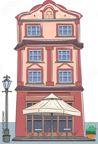 Outdoor summer cafe against the backdrop of a beautiful house.