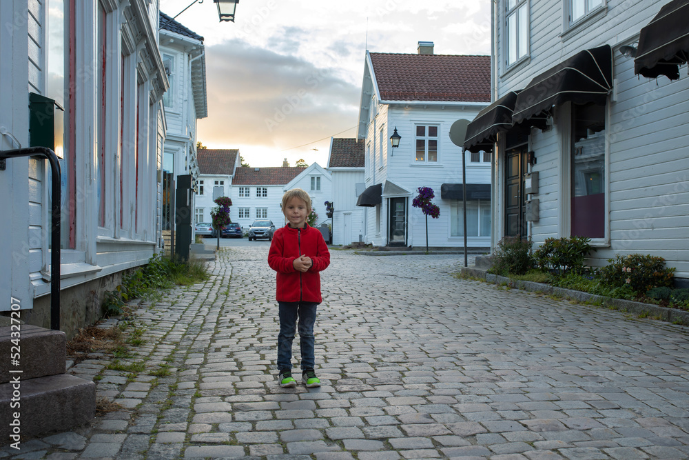 Family visiting Mandal in Norway, enjoying views, kids playing on sunset