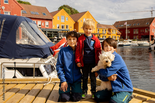 Beautiful town Kristiansand in Norway, family visiting Norway for summer vacation © Tomsickova