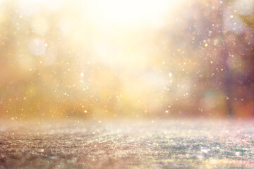 blurred abstract photo of light burst among trees and glitter bokeh lights