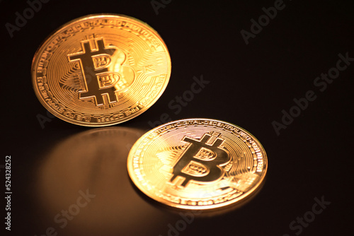 Bitcoin on a black background with reflection