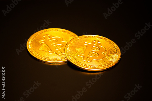Bitcoin on a black background with reflection
