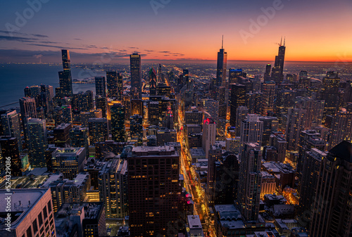 Fototapeta Cityscape aerial view of Chicago from observation deck at sunset.