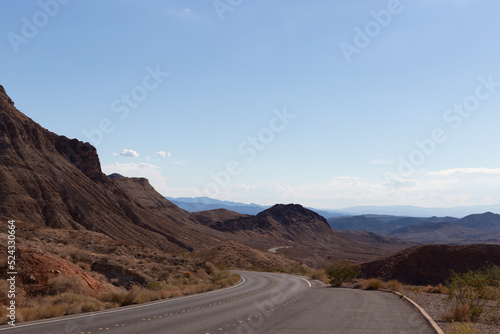 Curvy scenic winding desert highway Northshore road follows ancient red mountains more often than edges of the renowned lake