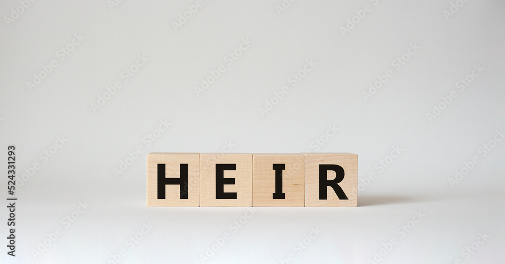 Heir symbol. Concept word Heir on wooden cubes. Beautiful white background. Business and Heir concept. Copy space Heir symbol. Concept word Heir on wooden cubes. Beautiful white background. Business and Heir concept. Copy space