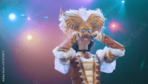 A theater actress wears a mask on stage. performance. actress. opera. performance