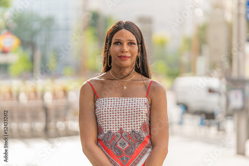 Portrait of a transgender woman outdoors. Mid shot photo