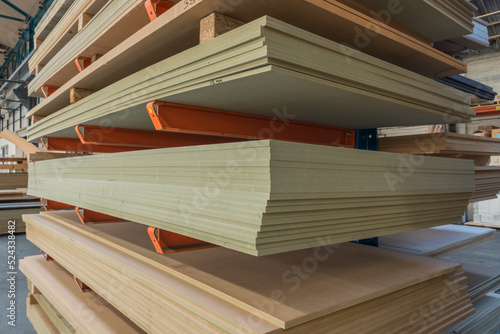 MDF sheet materials on cantilever rack in joinery workshop. photo