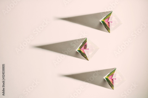 Three crystal pyramids with shadows, top view