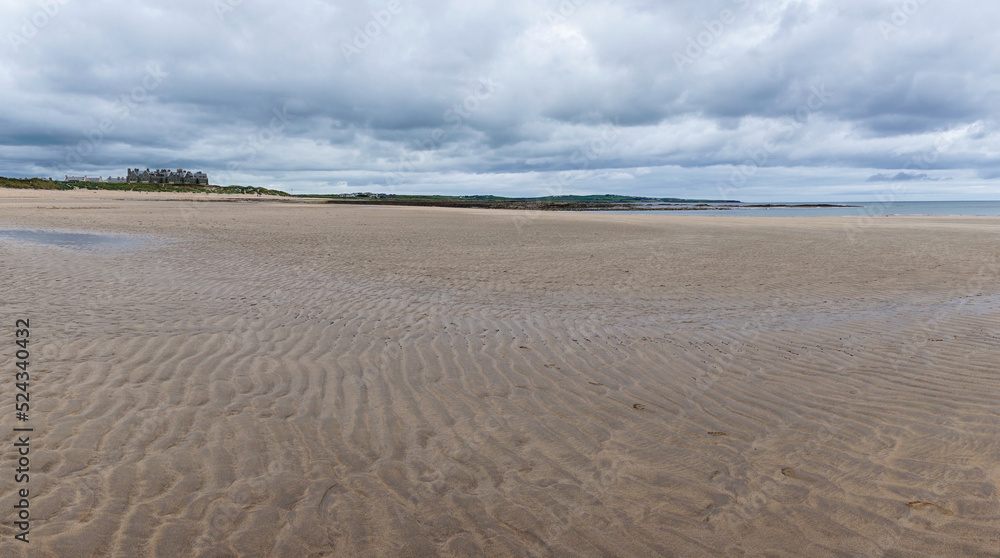 panorama landscape of Doughmore Bay and Beach with the Trump International Golf Club hotel in the background panorama landscape of Doughmore Bay and Beach with the Trump International Golf Club hotel in the background