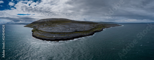 aerial view of the Burren Coast in County Clare with the Black Head Lighthouse on the rocky point photo
