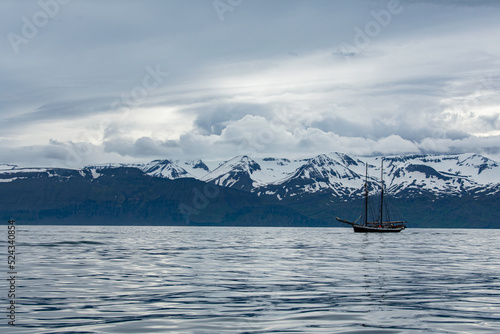 Old Fishing Ship In Front Of Snowy Mountains