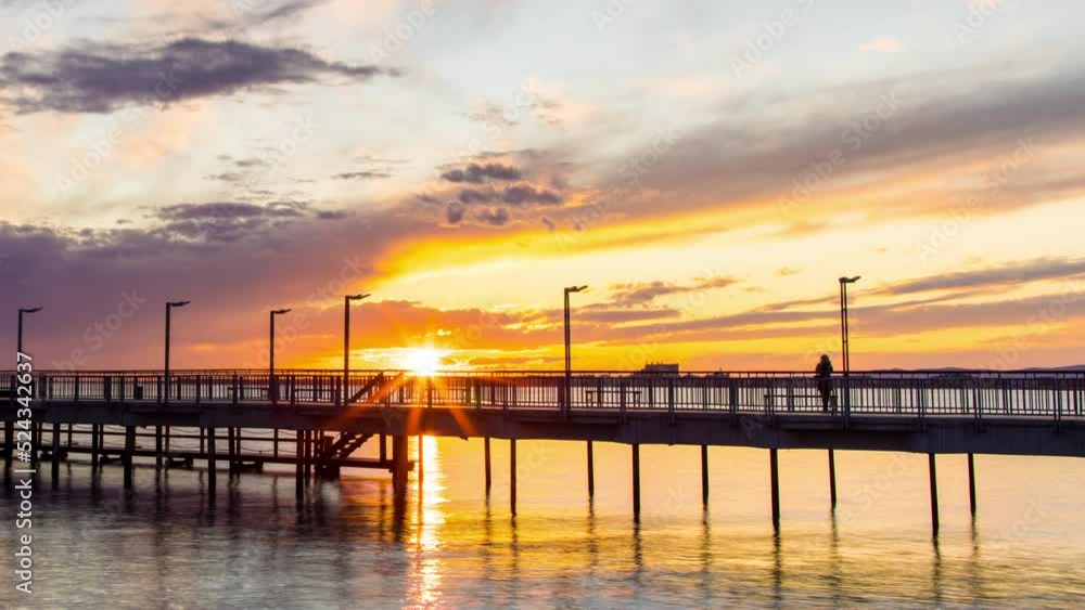 Side view of the pier on the Black Sea against the background of the sky and sunset Side view of the pier on the Black Sea against the background of the sky and sunset