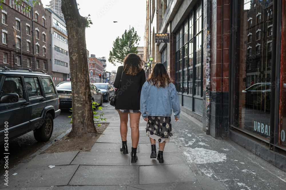 couple of girls walking on the street in London