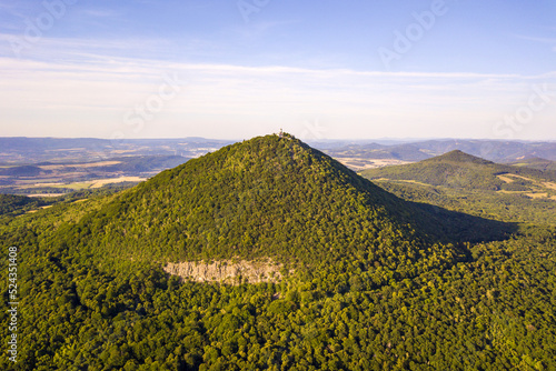 Aerial view of Milesovka mountain (837 m). The highest mountain of Ceske Stredohori, Czech Republic, Europe. photo