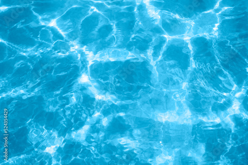 surface of blue swimming pool, or sea or ocean. background of water in swimming pool © Elena