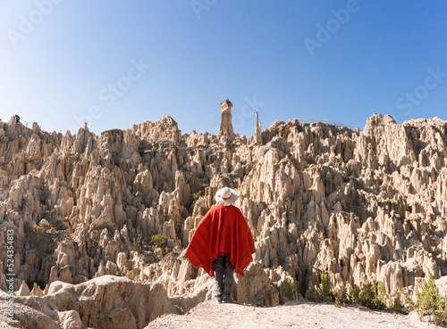 indigenous man looking the moon valley in bolivia photo