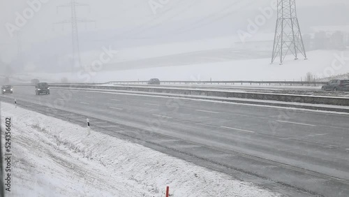 travel germany and bavaria, snow covered street at daytime with traffic in real time