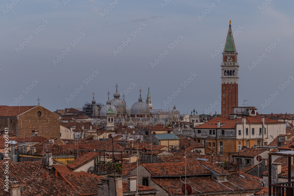 top and aerial view of the canals and roof of venice igrena at sunset