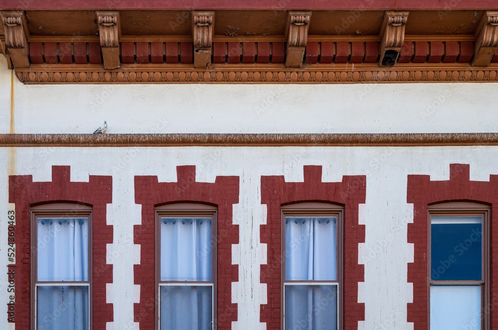 Red and Tan Facade on a Restored Victorian Building. Red and Tan Facade on a Restored Victorian Building.