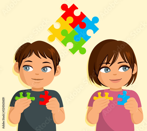 Two children holding puzzle pieces autism concept. World autism awareness day.