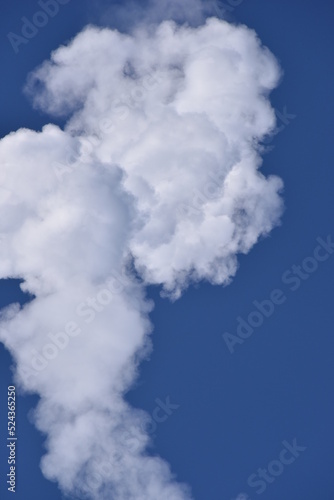 Smoke Plume cloud From Rocket Exhaust with a blue Sky  Clear sunny Day Fog and cloud atmosphere isolated