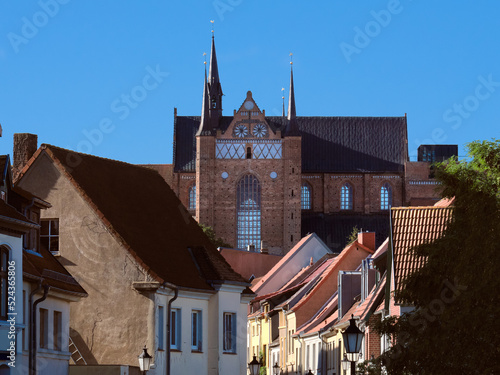 Historical houses and St. George's Church, example of North German Brick Gothic architecture. Mecklenburg-Vorpommern region of Germany. photo