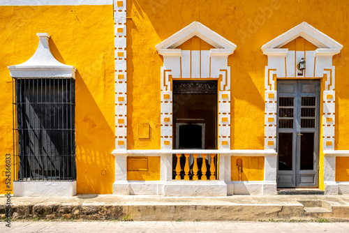 Typical old yellow house at the magical town of Izamal in Yucatan photo