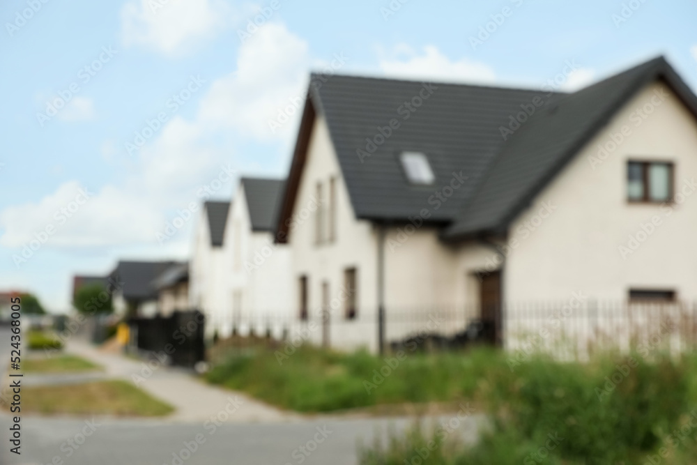 Blurred view of street with beautiful houses