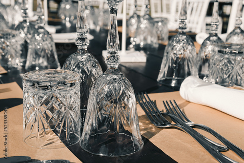 Boho wedding table decoration for a newlywed banquet focus is on the glass